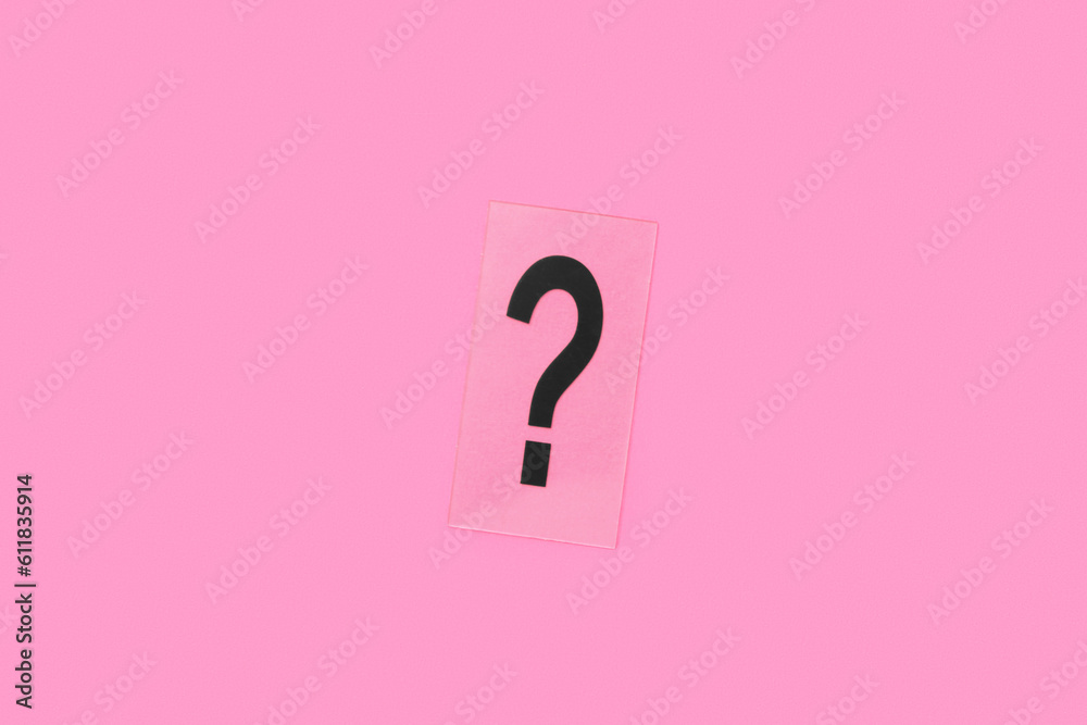 Paper with question mark on pink background