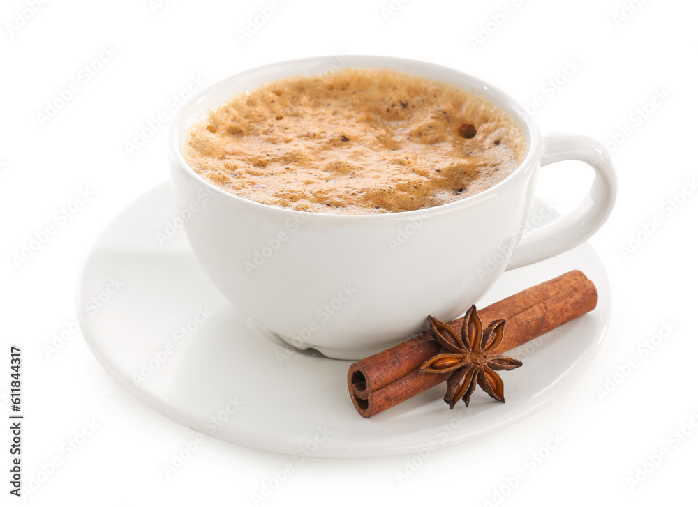 Cup of delicious espresso with spices and saucer on white background