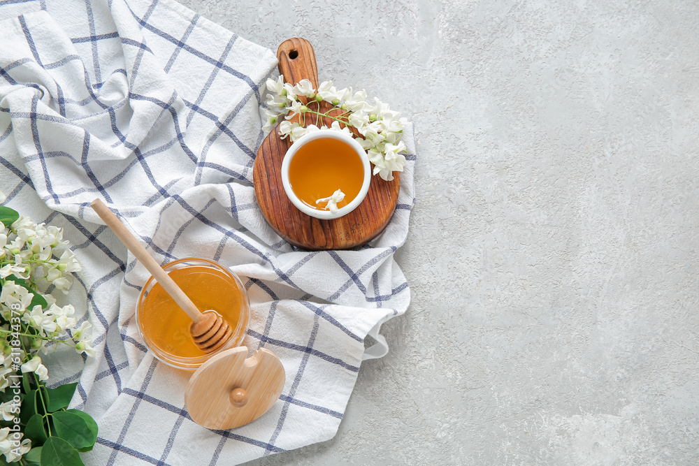 Composition with sweet honey and acacia flowers on light background