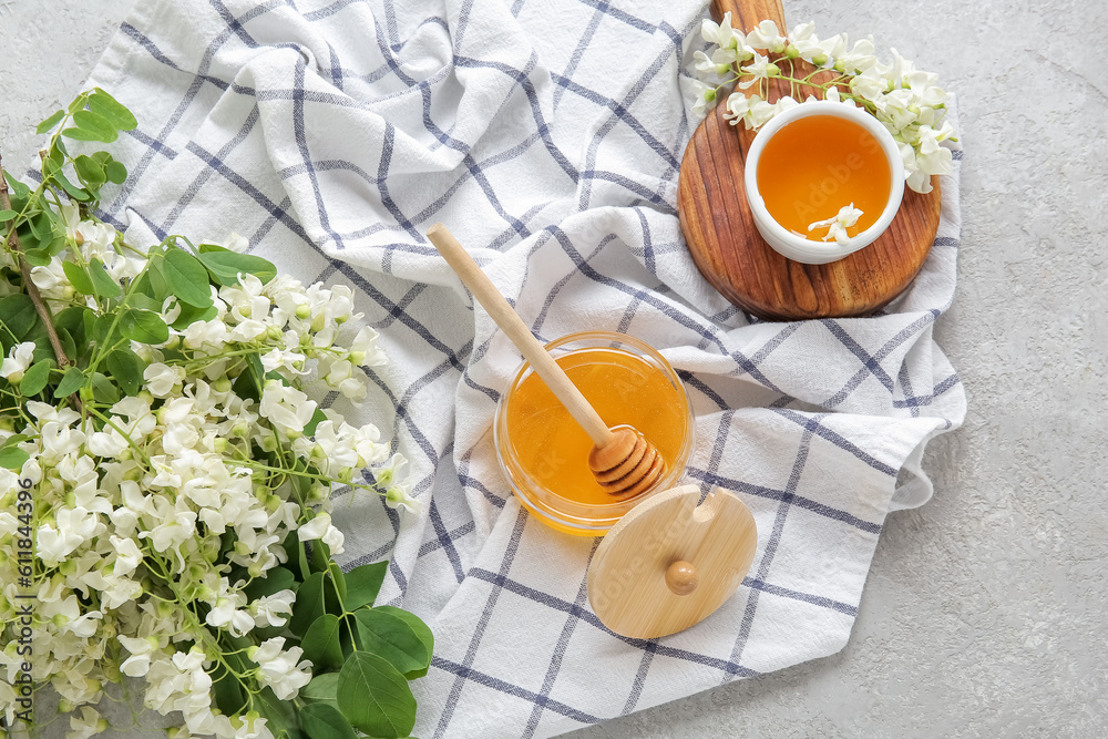 Composition with sweet honey and acacia flowers on light background