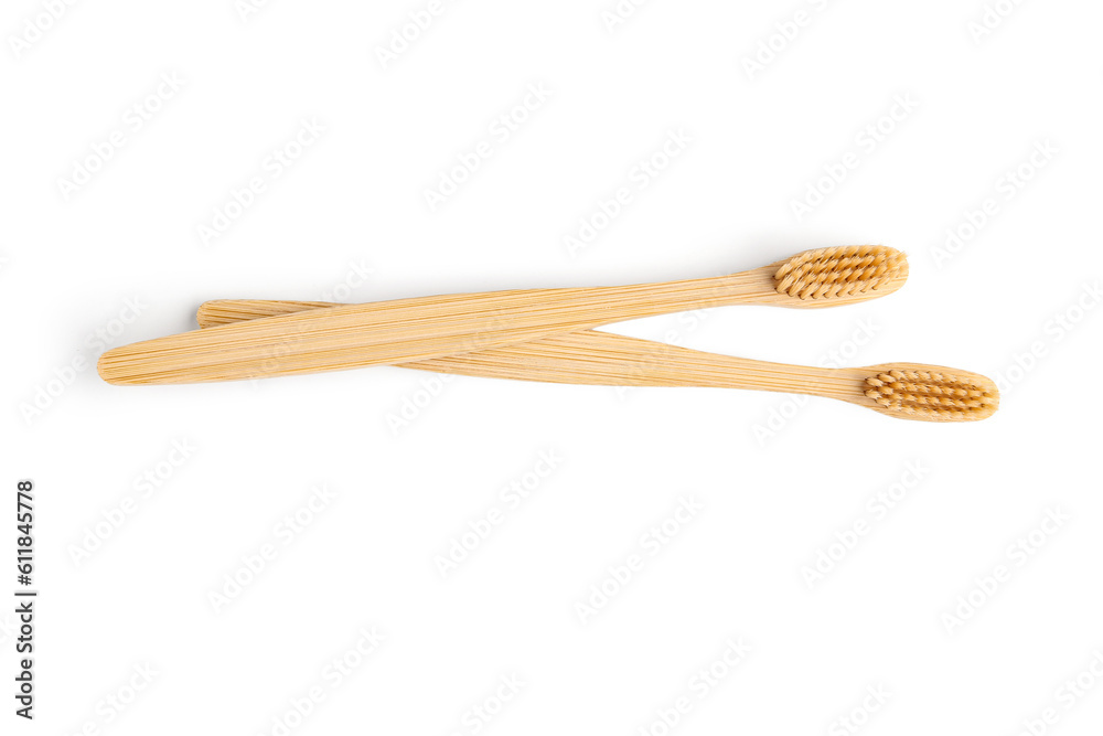 Bamboo toothbrushes on white background