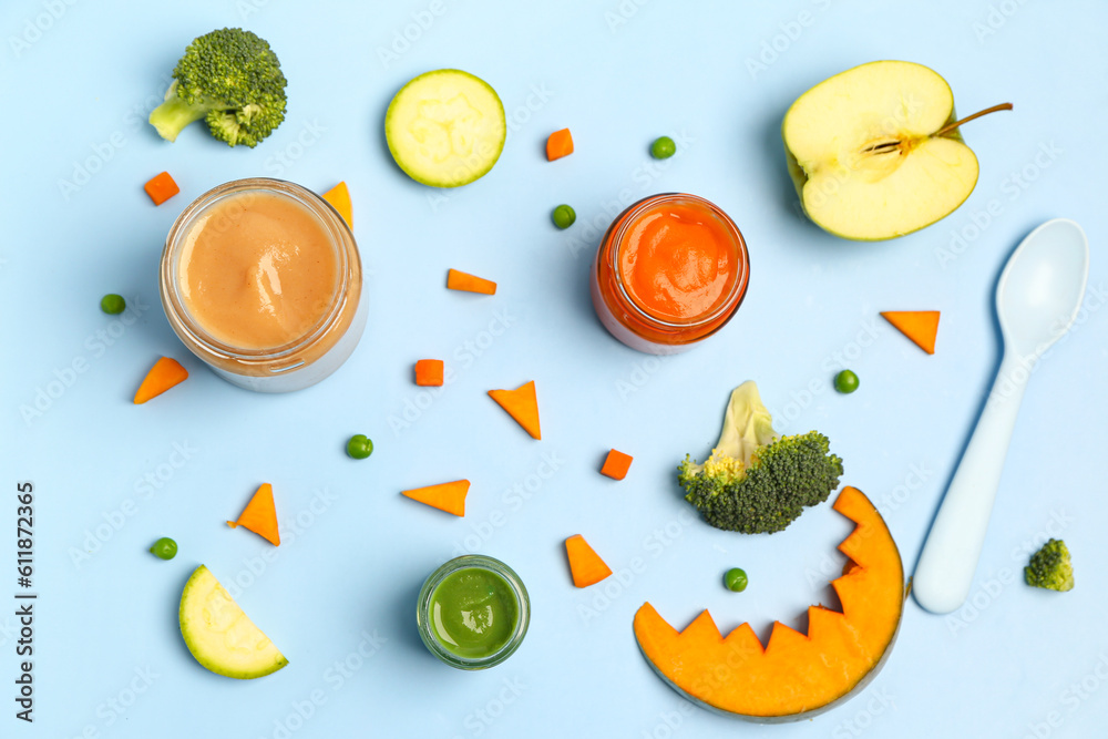 Composition with jars of healthy baby food and ingredients on color background