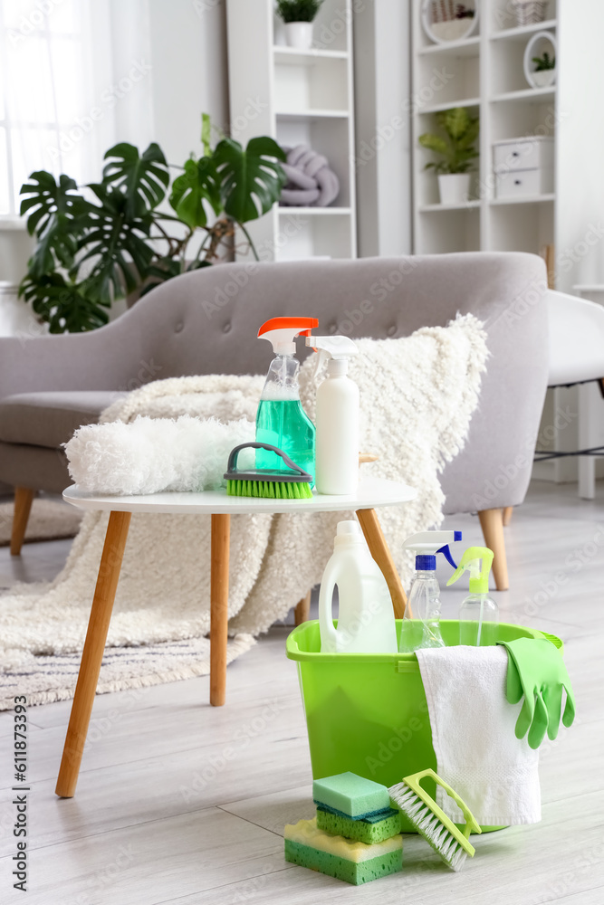 Table with cleaning supplies in living room