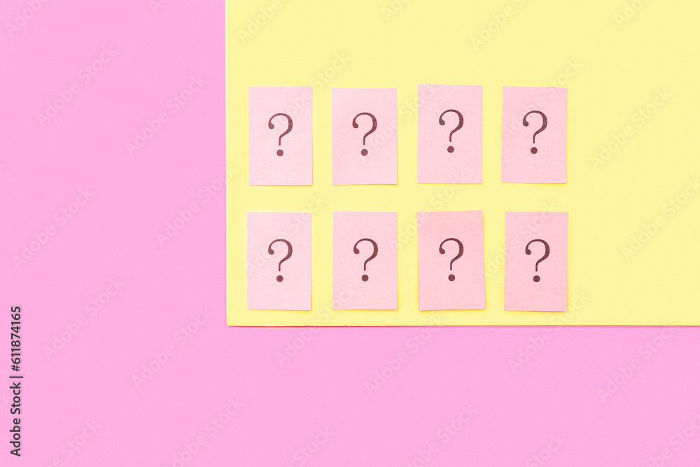 Papers with question marks on color background