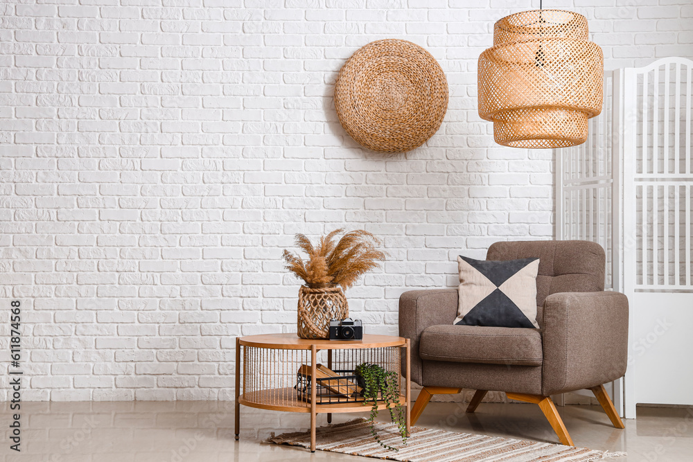 Interior of cozy living room with armchair and coffee table