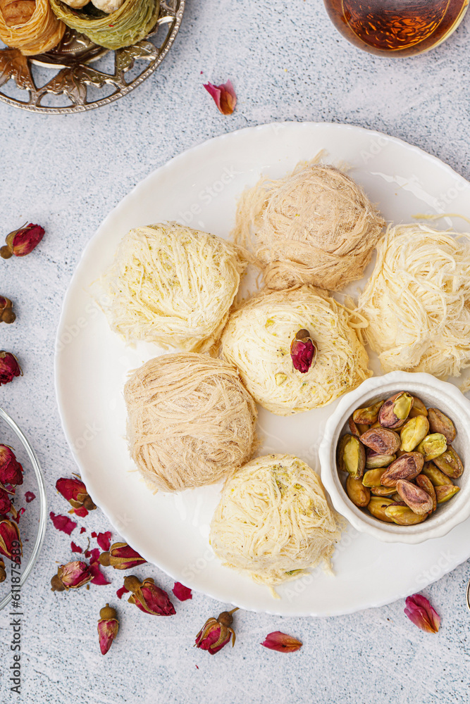 Plate with tasty Turkish Pismaniye on light background, closeup