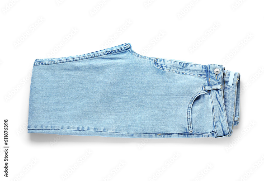 Folded jeans on white background