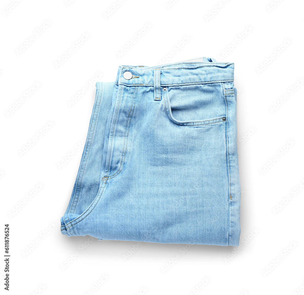 Folded jeans on white background