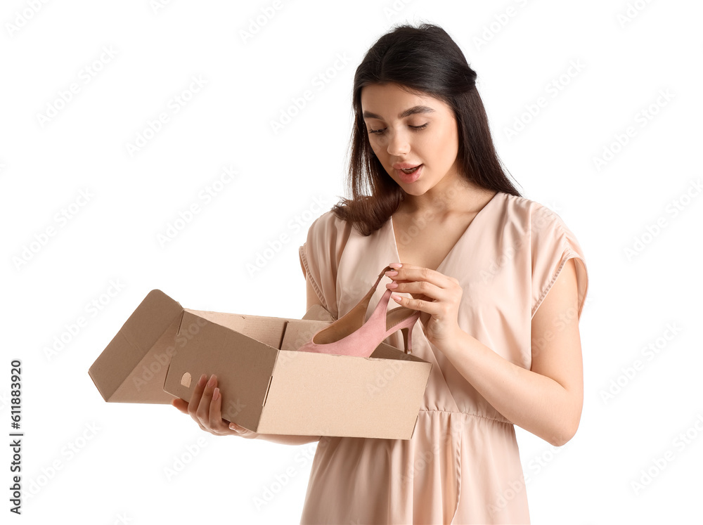 Young woman with shoe box on white background