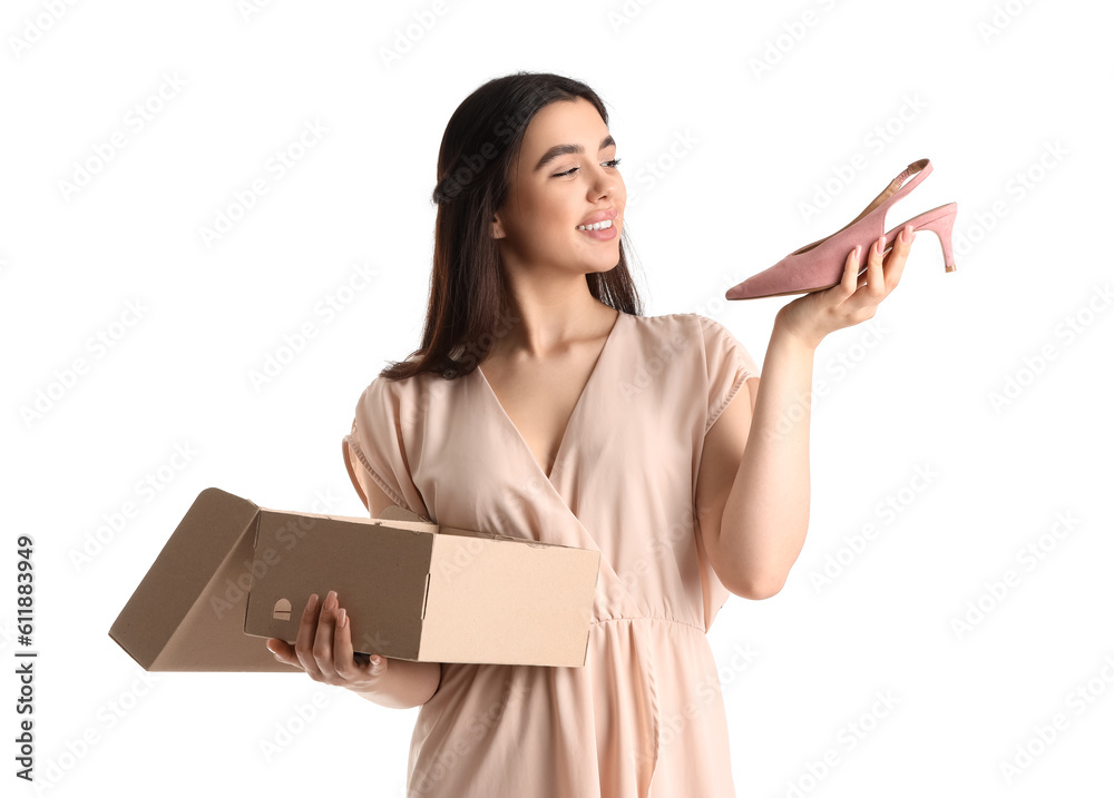 Young woman with shoe box on white background