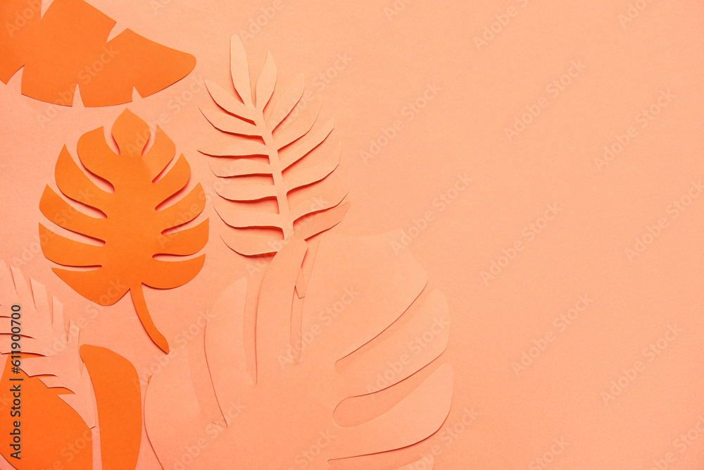 Different tropical leaves on orange background