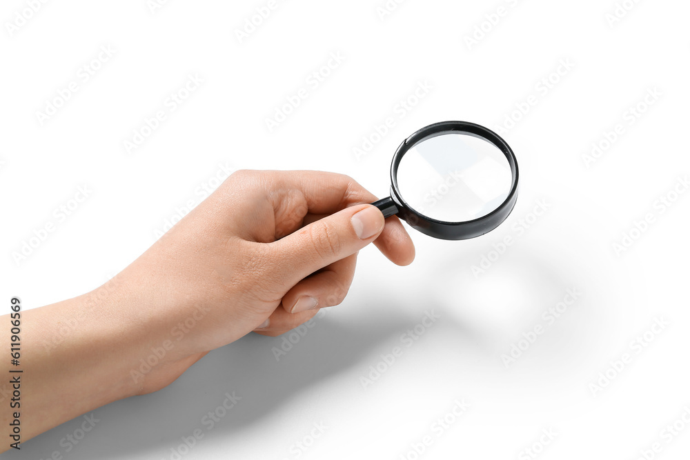 Female hand with mini magnifier isolated on white background