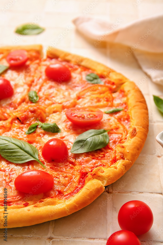 Tasty pizza margarita on beige tile background