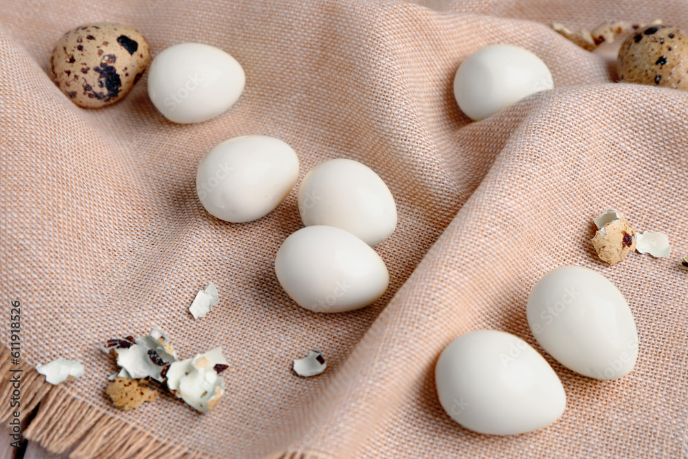 Boiled quail eggs with shells, closeup