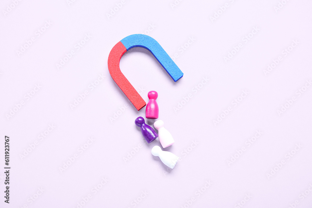 Magnet attracting group of customers on lilac background. Marketing concept