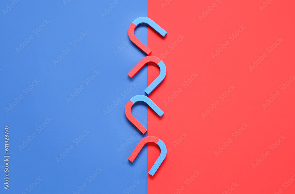 Horseshoe shaped magnets on color background