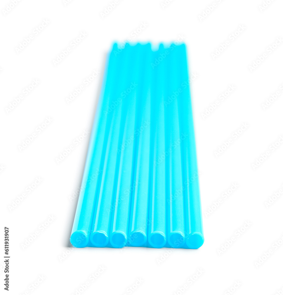 Blue plastic straws on white background