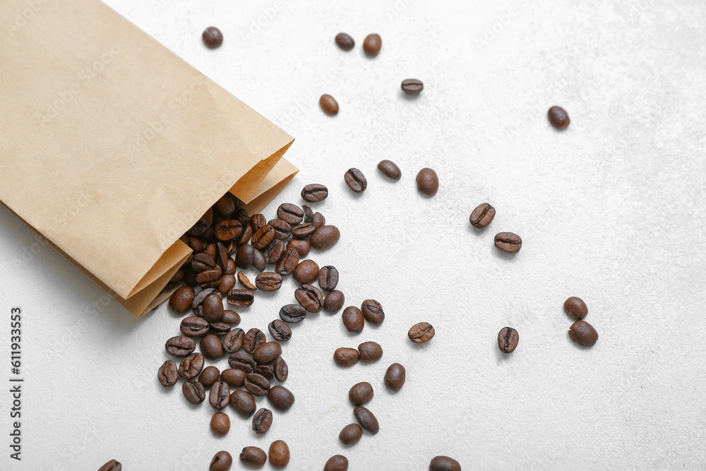 Package with coffee beans on light background