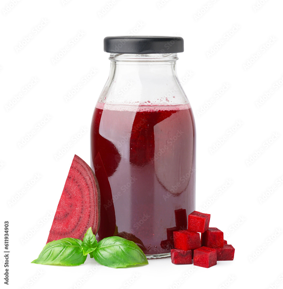 Bottle of healthy beet juice and basil on white background