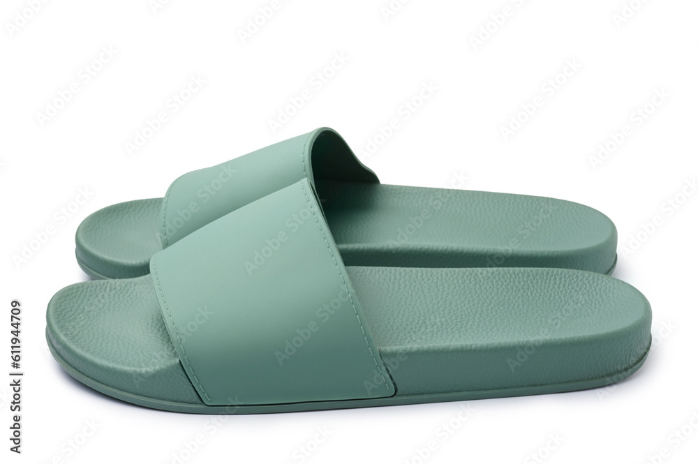 Pair of stylish green flip-flops on white background