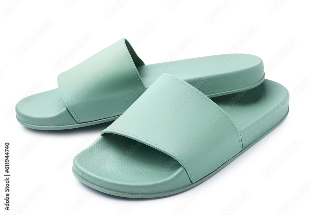 Pair of stylish green flip-flops on white background