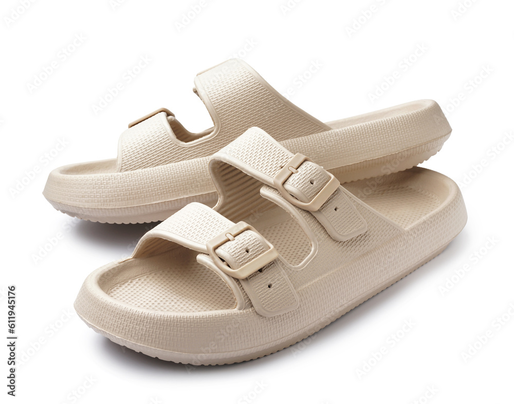 Pair of stylish beige flip-flops on white background