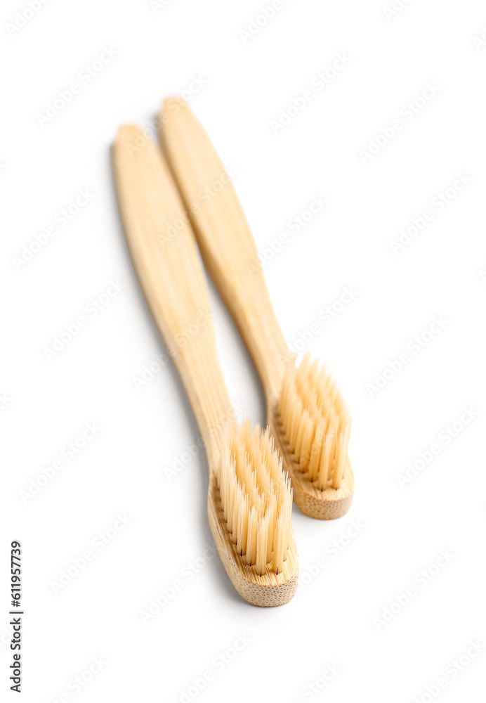 Bamboo toothbrushes on white background