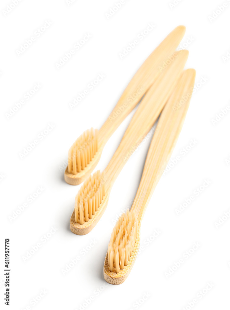 Bamboo toothbrushes on white background