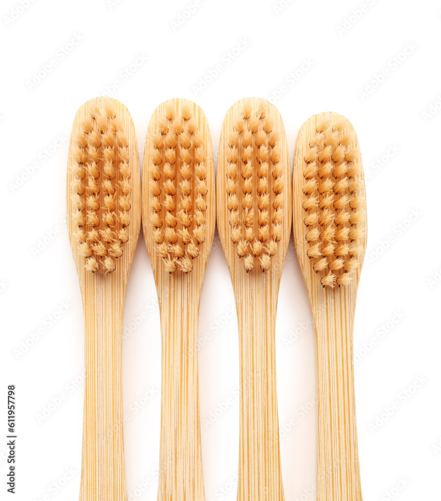 Many bamboo toothbrushes on white background