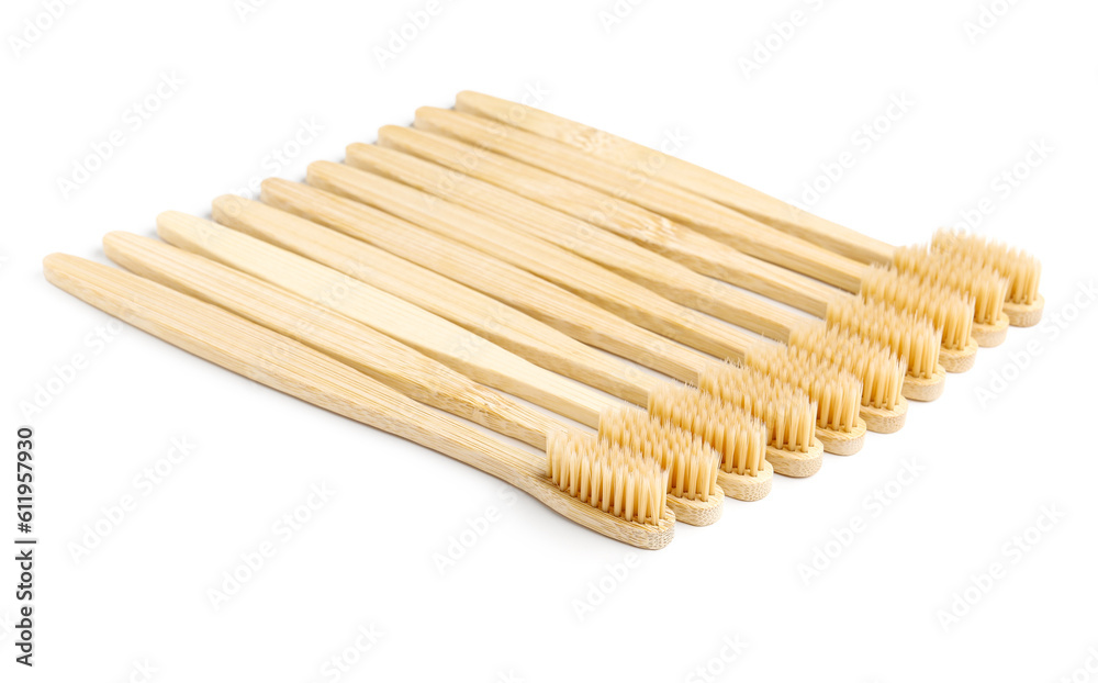 Many bamboo toothbrushes on white background