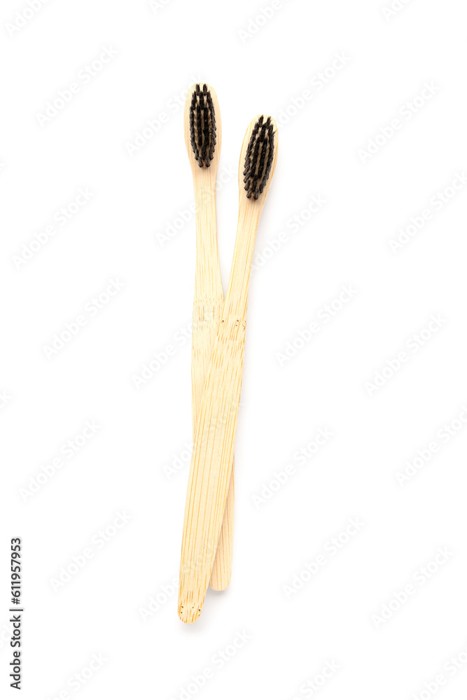 Bamboo toothbrushes on white background