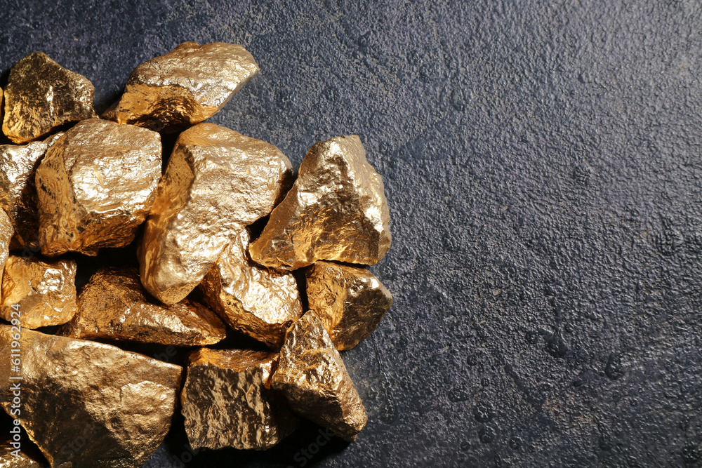 Golden nuggets on dark background