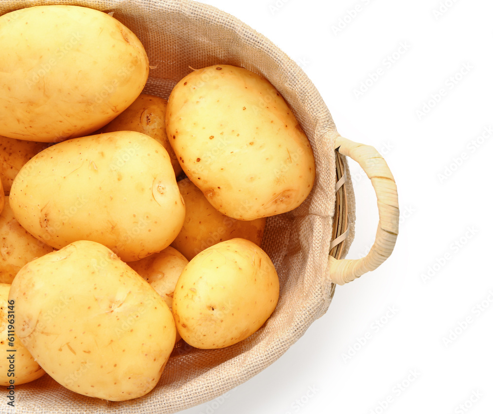 Wicker basket with raw baby potatoes on white background