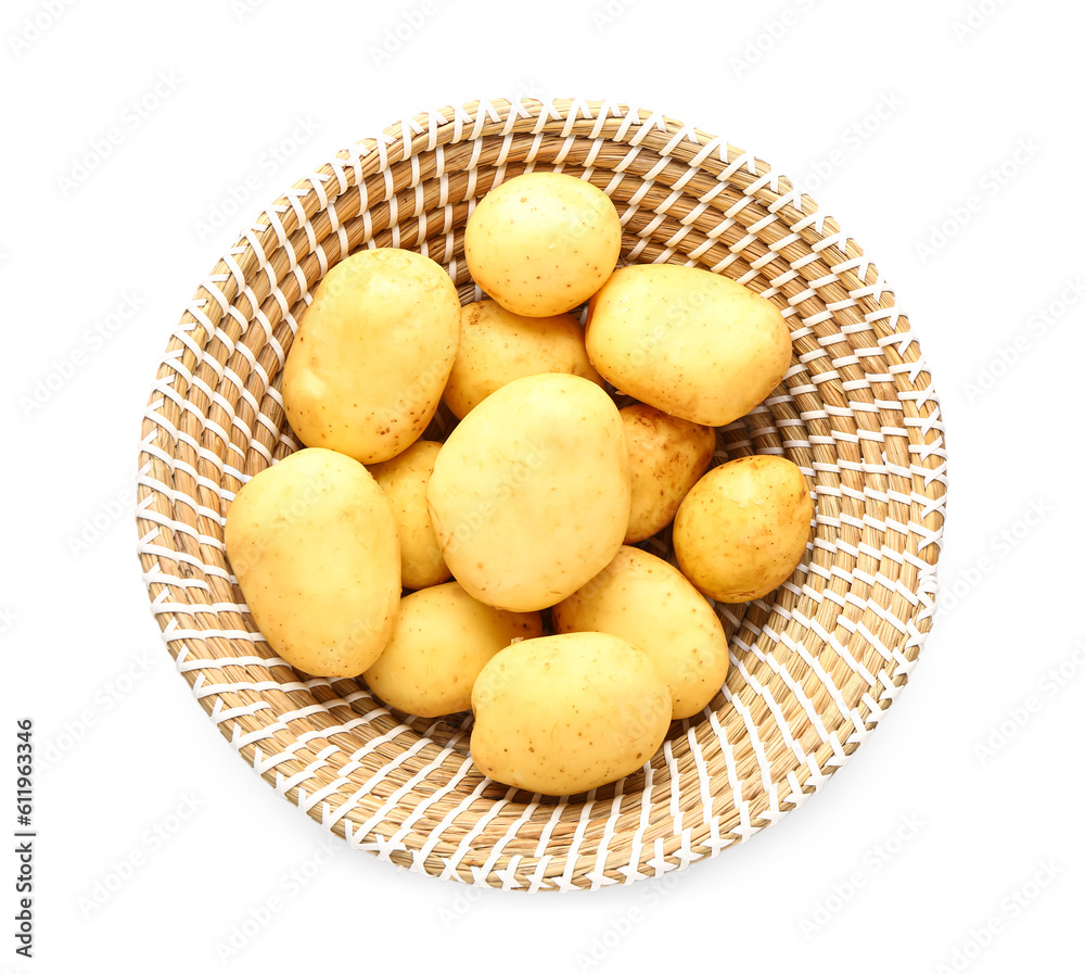 Wicker bowl with raw baby potatoes on white background