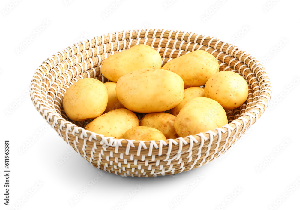 Wicker bowl with raw baby potatoes on white background