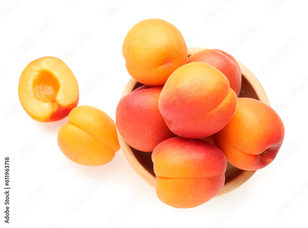 Bowl with ripe apricots isolated on white background