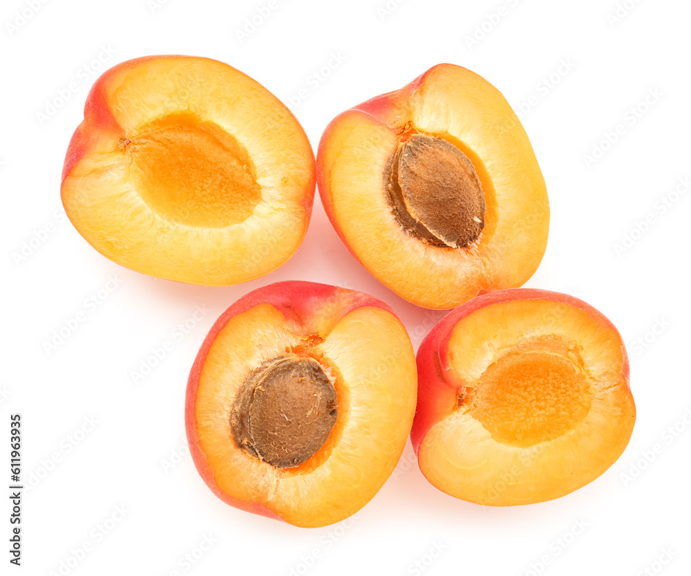 Halves of ripe apricot isolated on white background