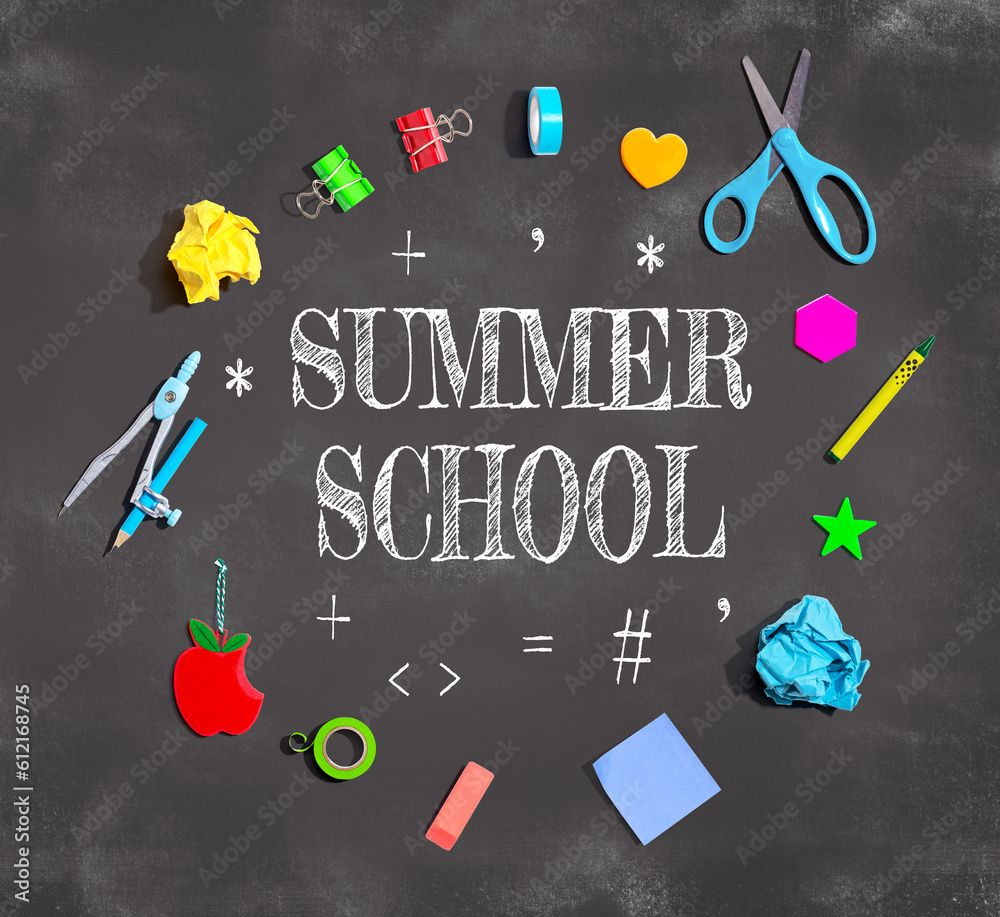 Summer School theme with school supplies on a chalkboard - flat lay