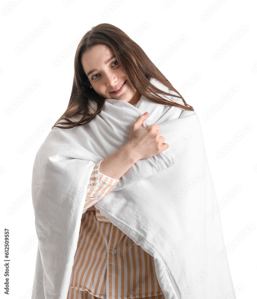 Young woman with soft blanket on white background