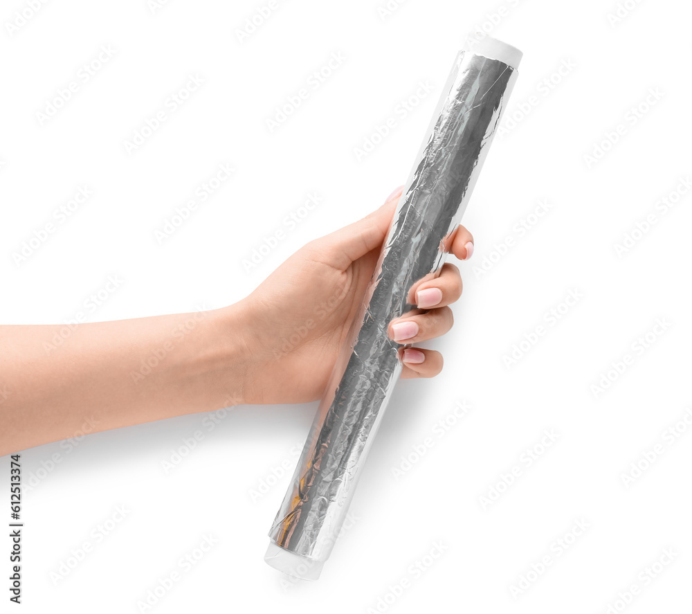 Female hand with roll of aluminium foil on white background