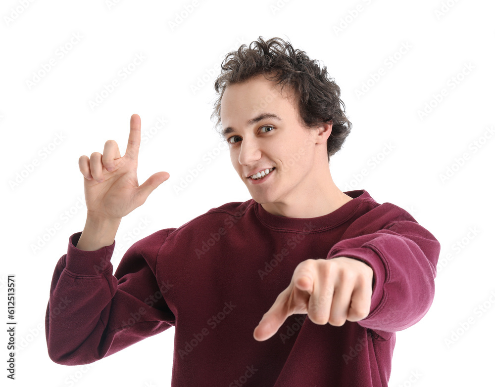 Young man showing loser gesture on white background