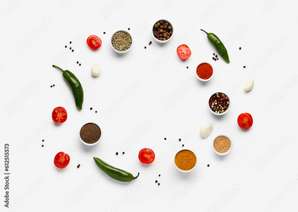 Frame made of aromatic spices and fresh vegetables on light background