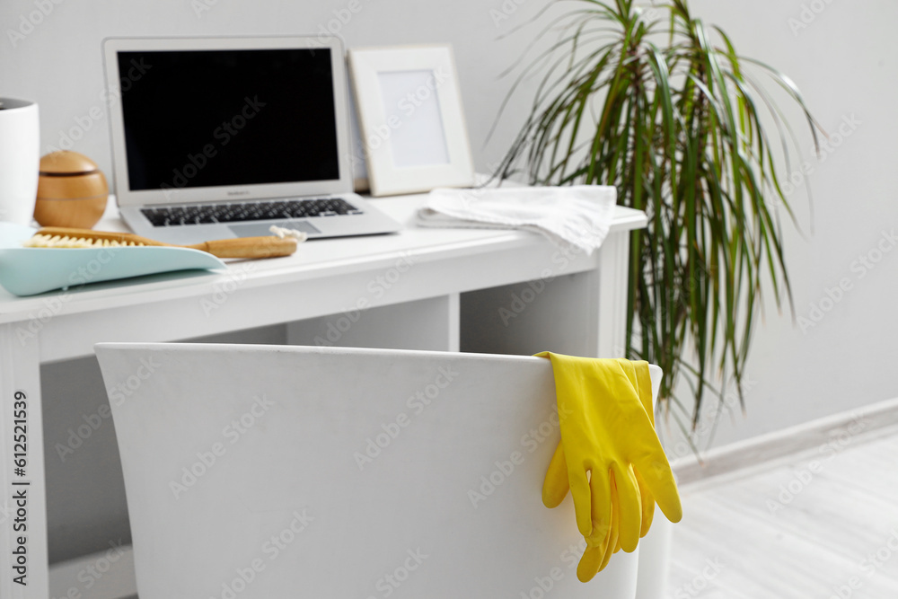 Chair with rubber gloves in office, closeup