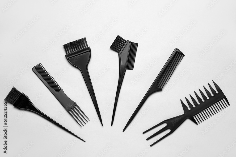 Hairdressers brushes on grey background