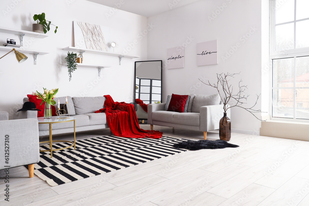 Interior of stylish living room with cozy sofas and coffee table