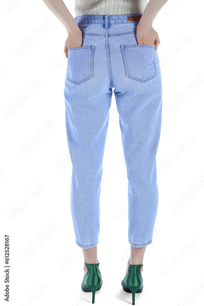 Young woman in stylish jeans on white background, back view