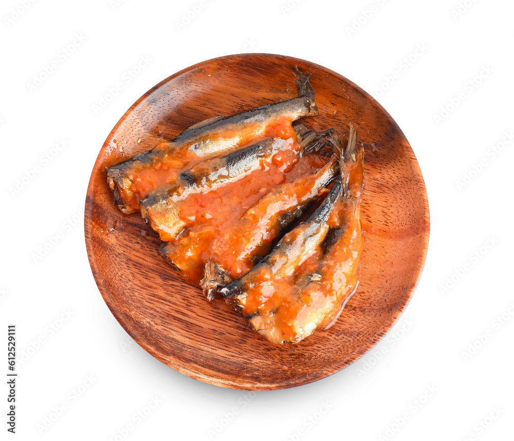 Wooden plate with canned fish in tomato sauce isolated on white background