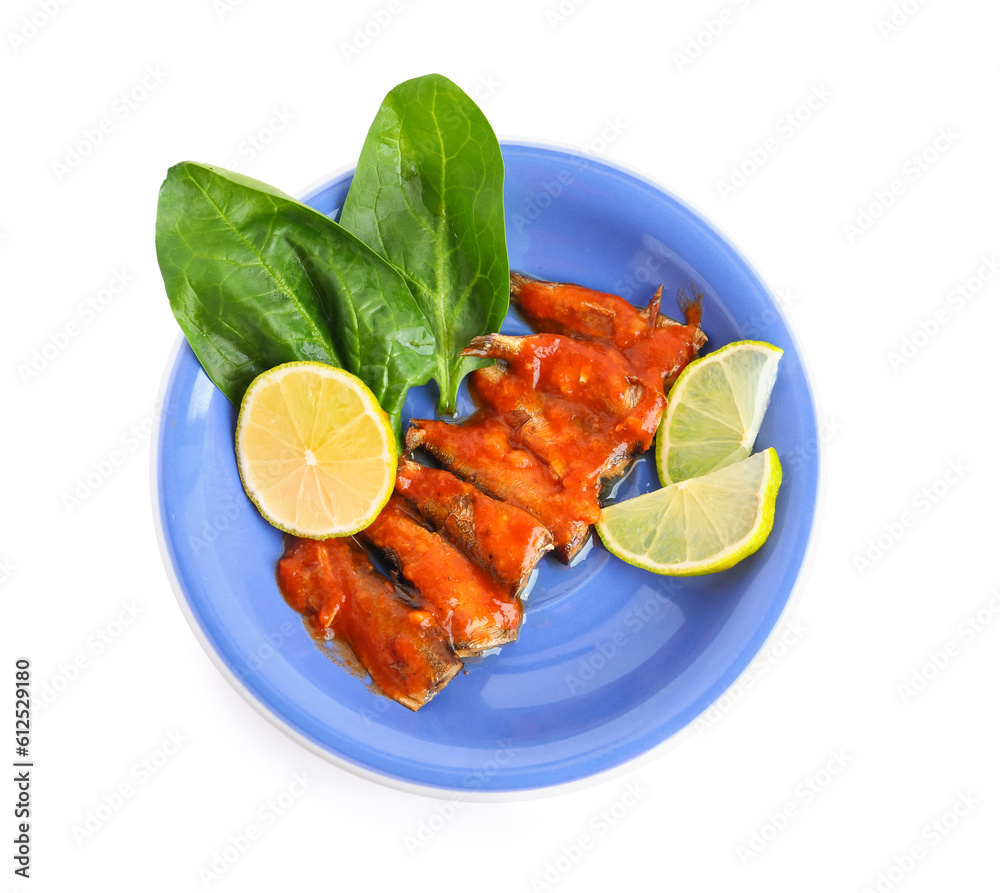 Plate with canned fish in tomato sauce isolated on white background