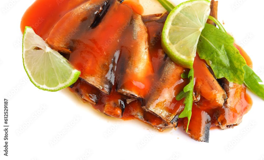 Canned fish in tomato sauce with lime slices and arugula isolated on white background