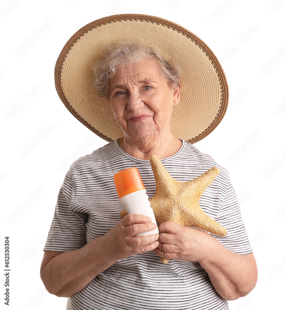 Senior woman with sunscreen cream and starfish on white background